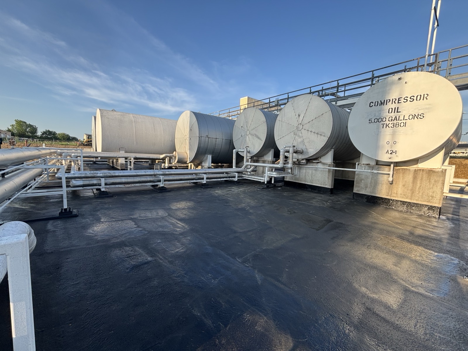 PHX6700 polyurea secondary-containment lining around compressor-oil storage tanks