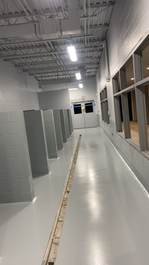 Finished gray epoxy corridor in a K9 boarding facility